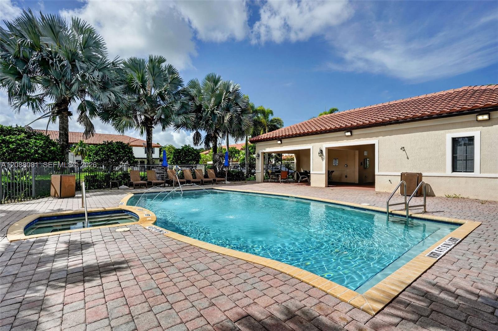 Private paver patio beside the lake